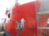 Spray painting a vessel red