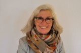 Woman with blond hair smiling