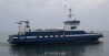 blue ferry in calm sea